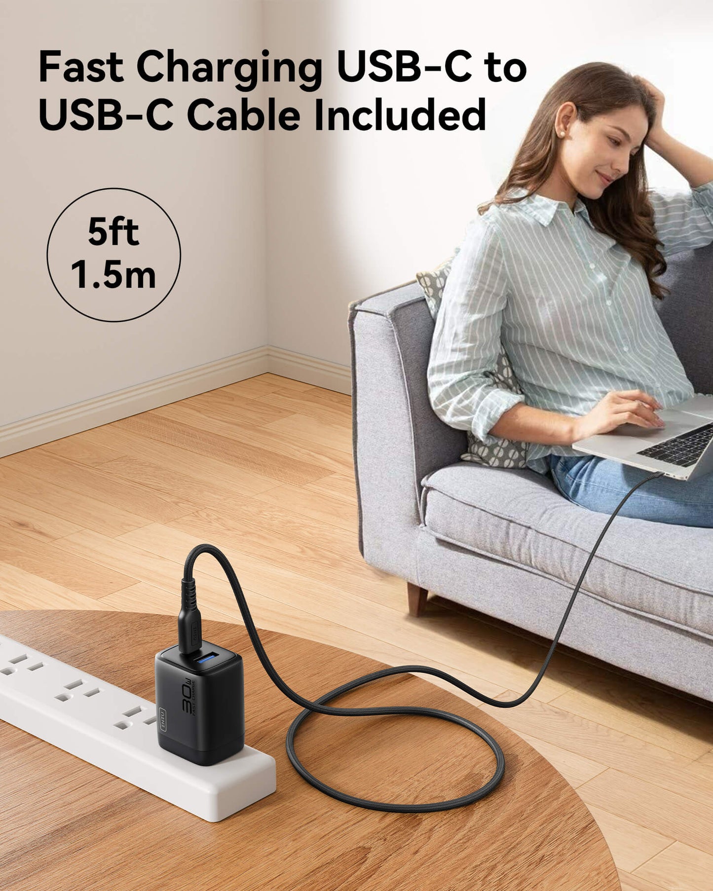 INIU A12-E1 Charger with USB-C cable, 30W fast charging, woman using laptop on couch