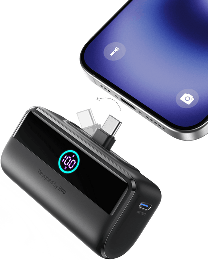 INIU P45-E1 Power Bank charging phone. Displays 100% charge. Black power bank with USB-C ports.